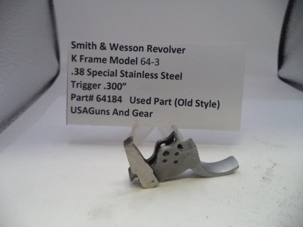 Smith & Wesson revolver trigger part with descriptive label on a white background