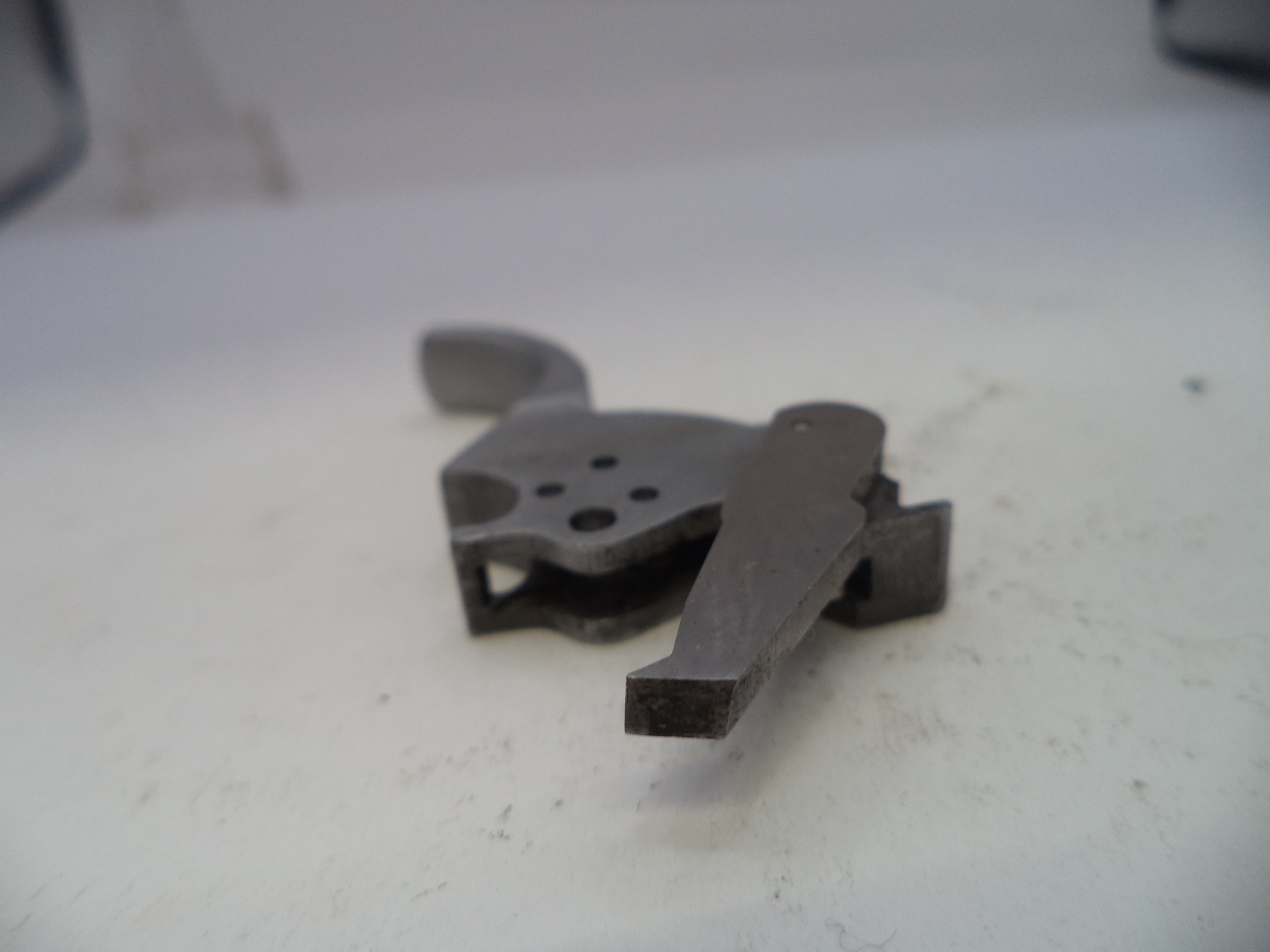 Metallic object on a white surface