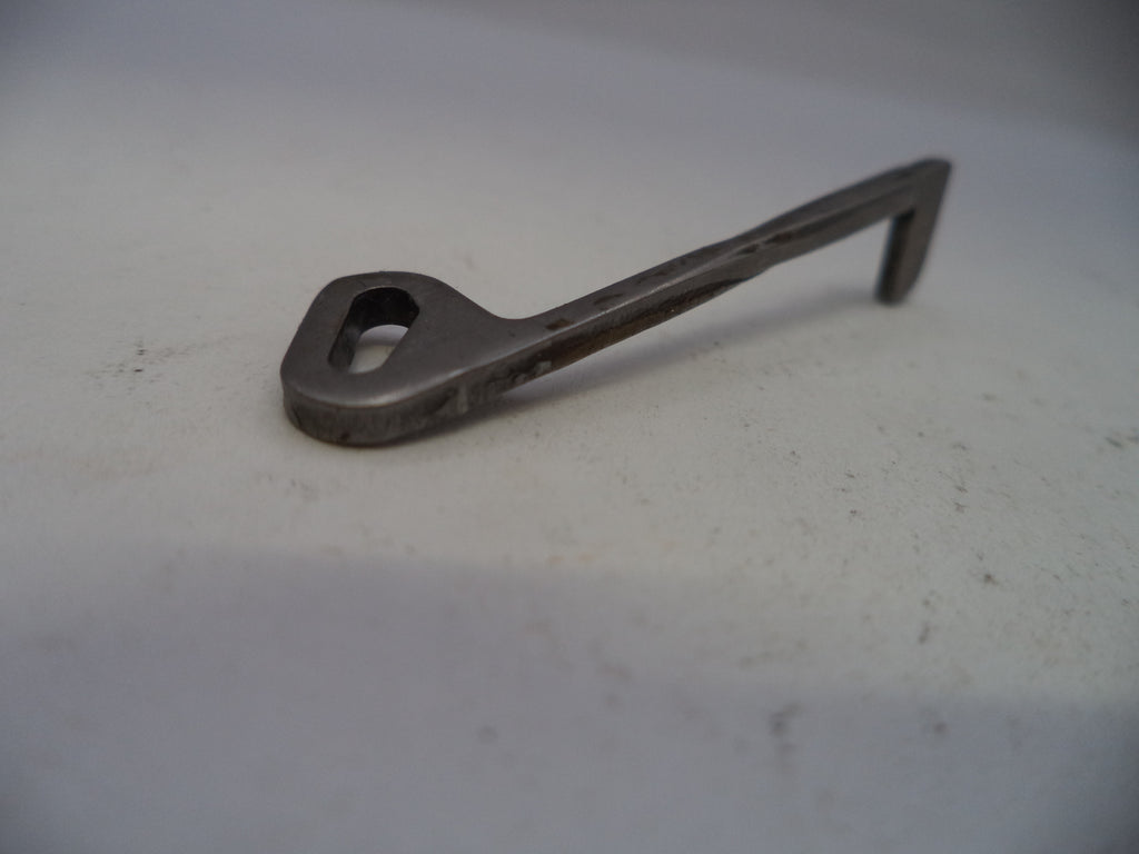 Metal key on a light gray background