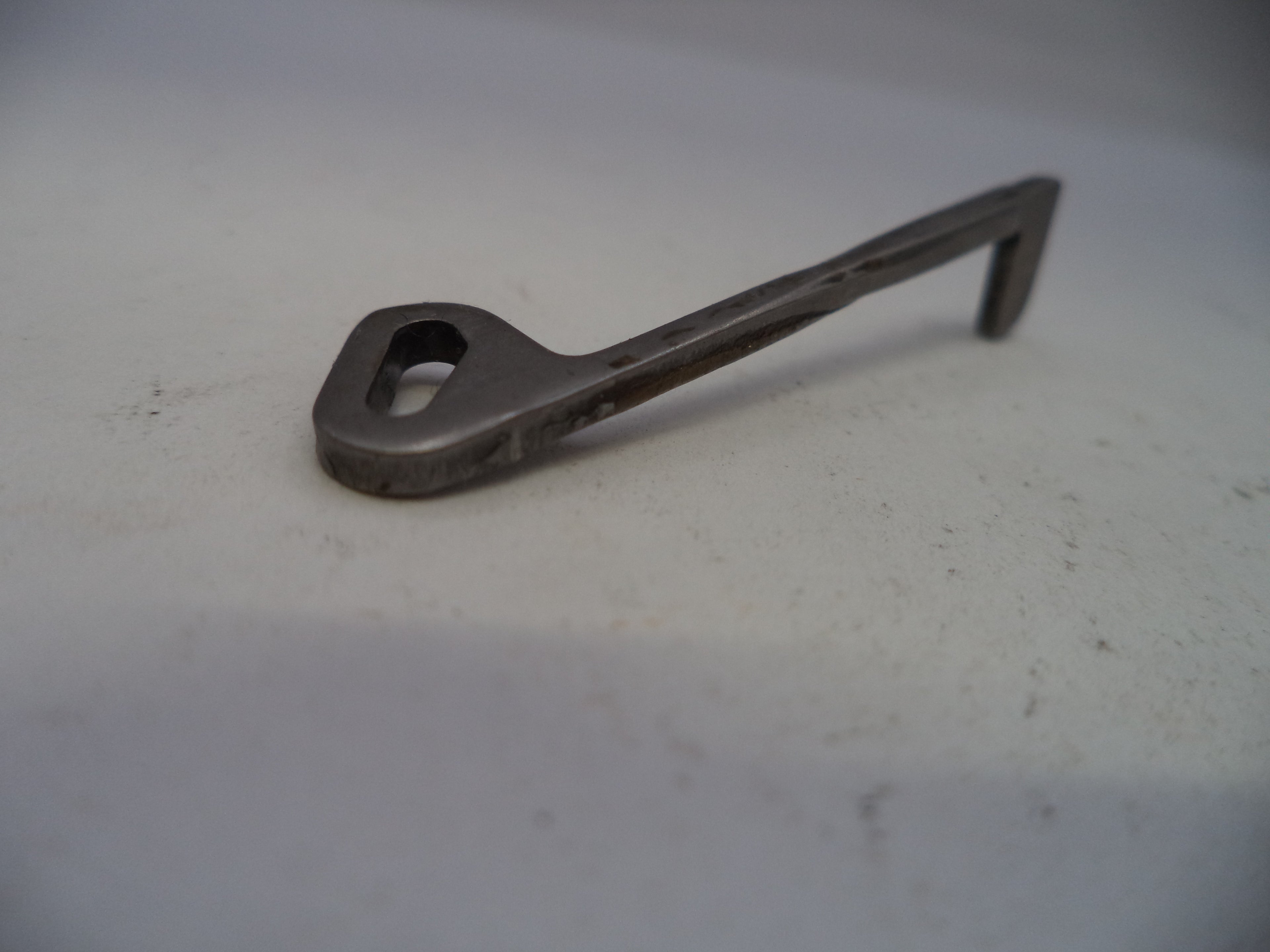 Metal key on a light gray background