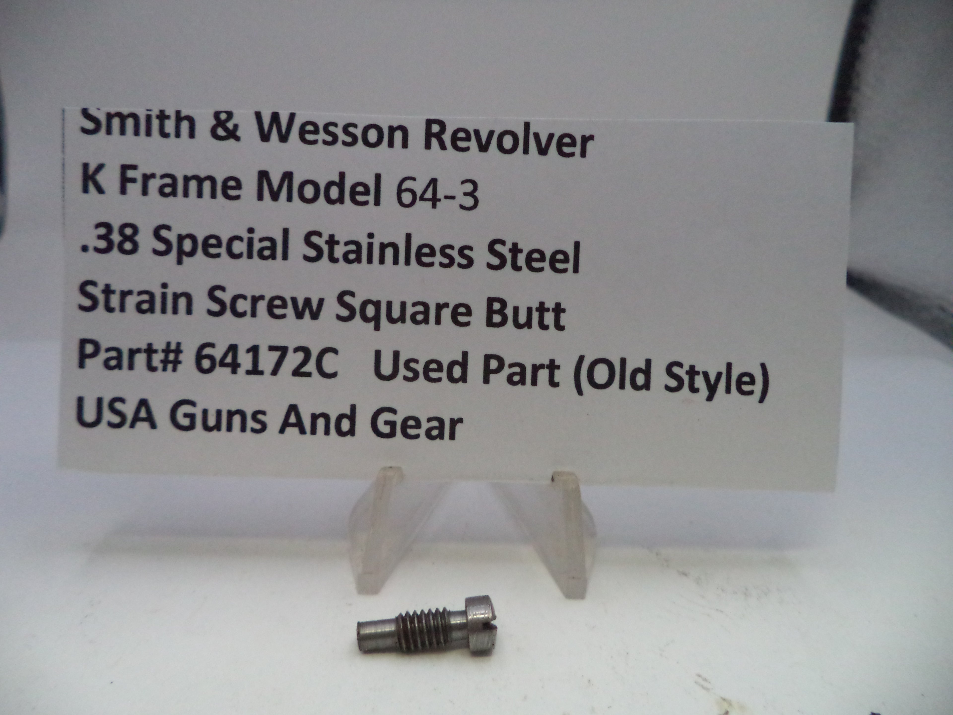 Smith & Wesson revolver part with descriptive label on a white background
