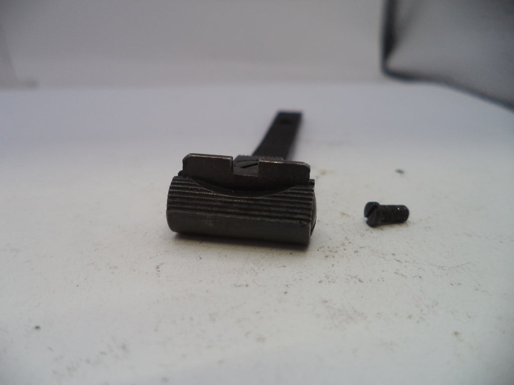 Black metal component on a white surface