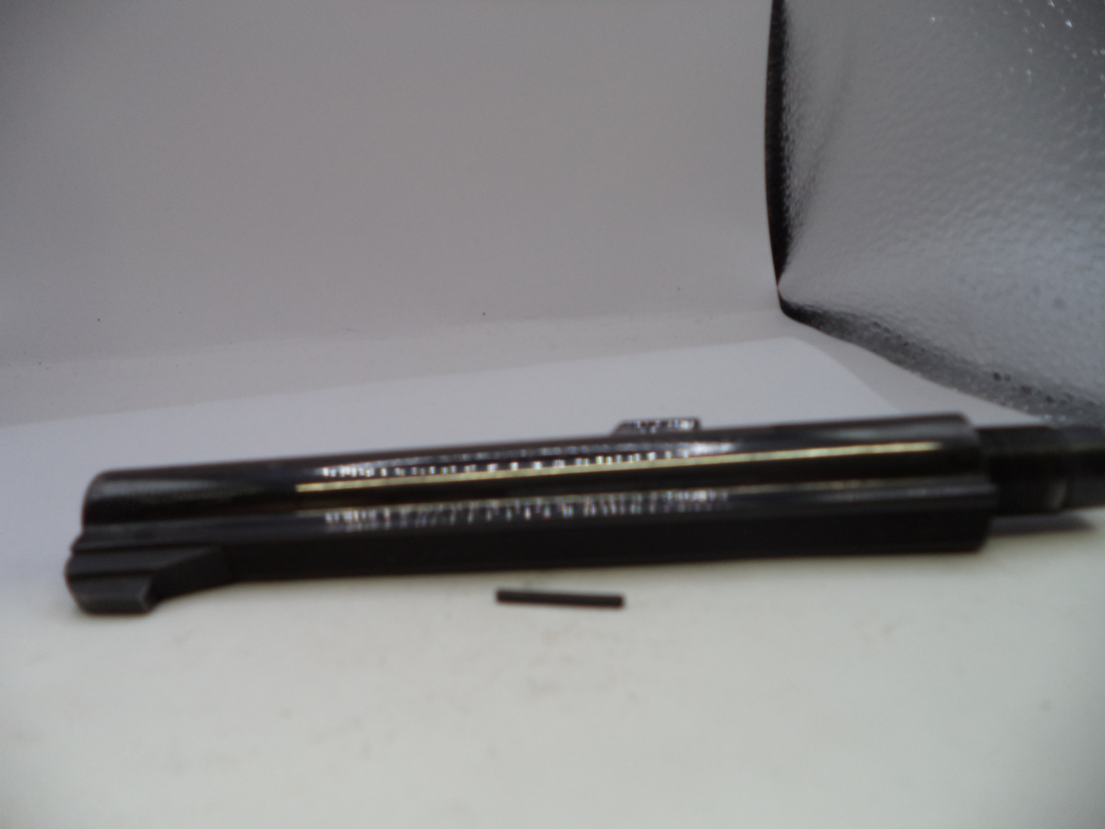 Car windshield wiper blade on a gray background