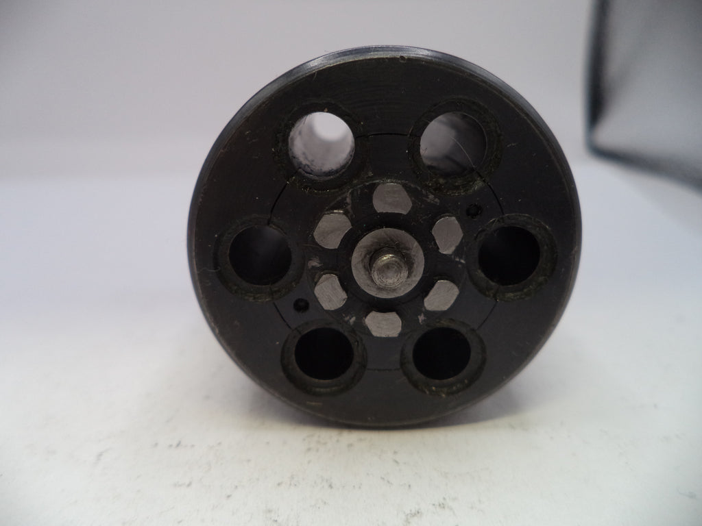 Black cylindrical object with multiple holes on a white background