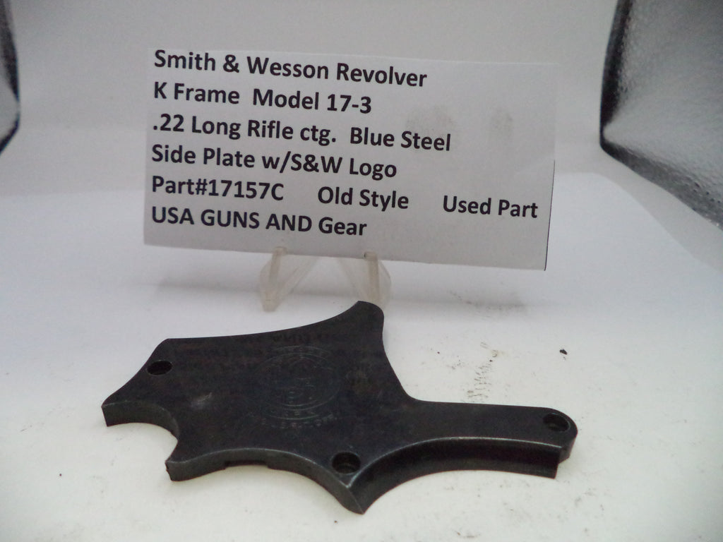 Smith & Wesson revolver side plate with descriptive label on a white background