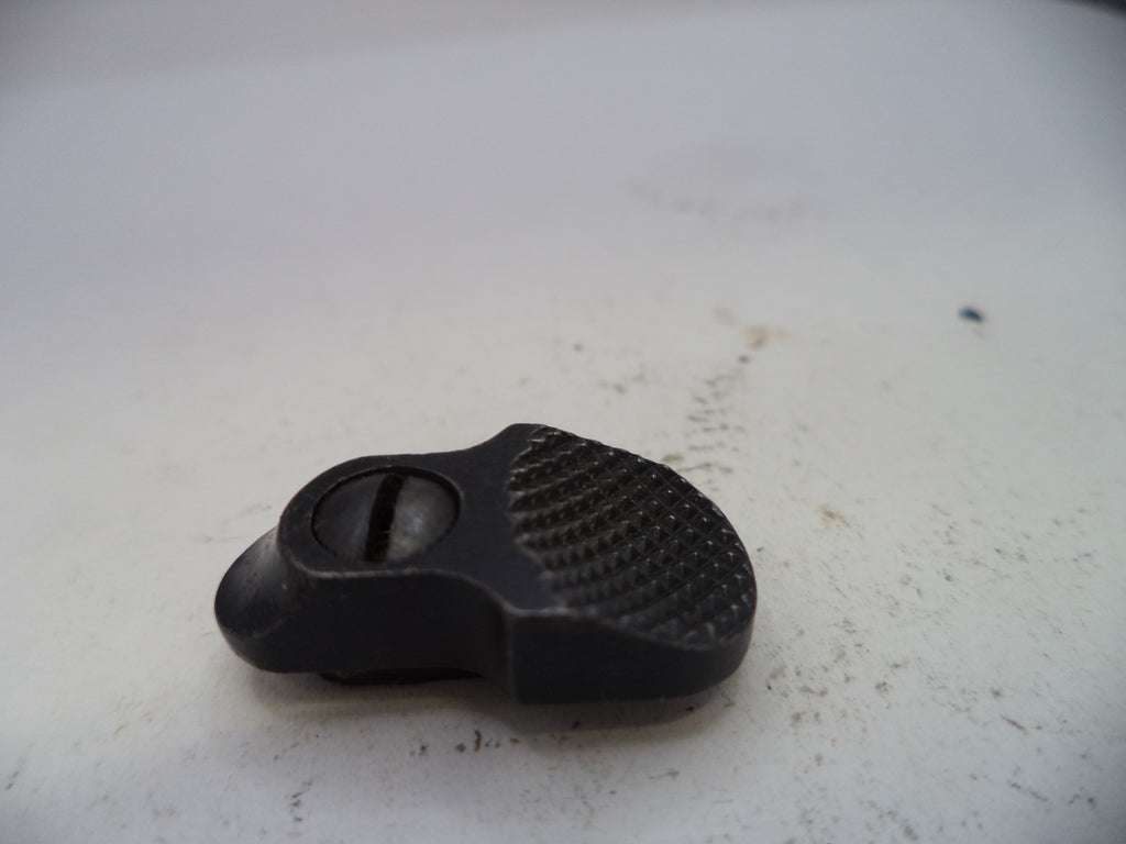 Black plastic component on a white surface