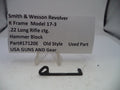 Smith & Wesson revolver hammer block part on a white background with descriptive text card.