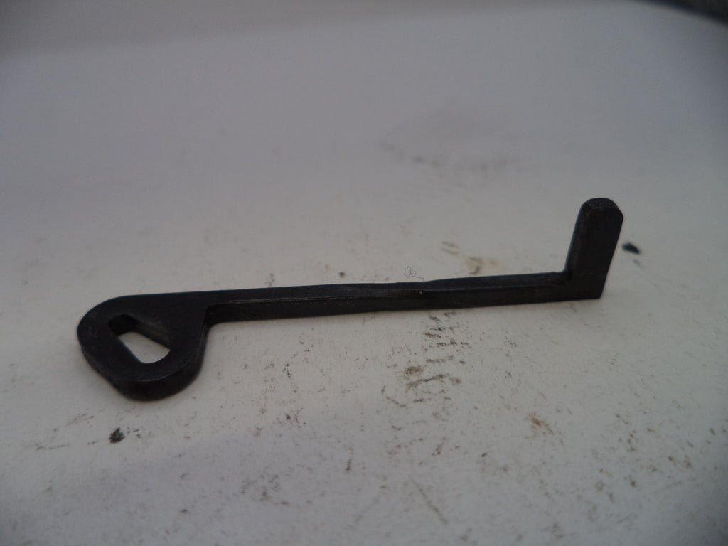 Black metal tool on a white surface