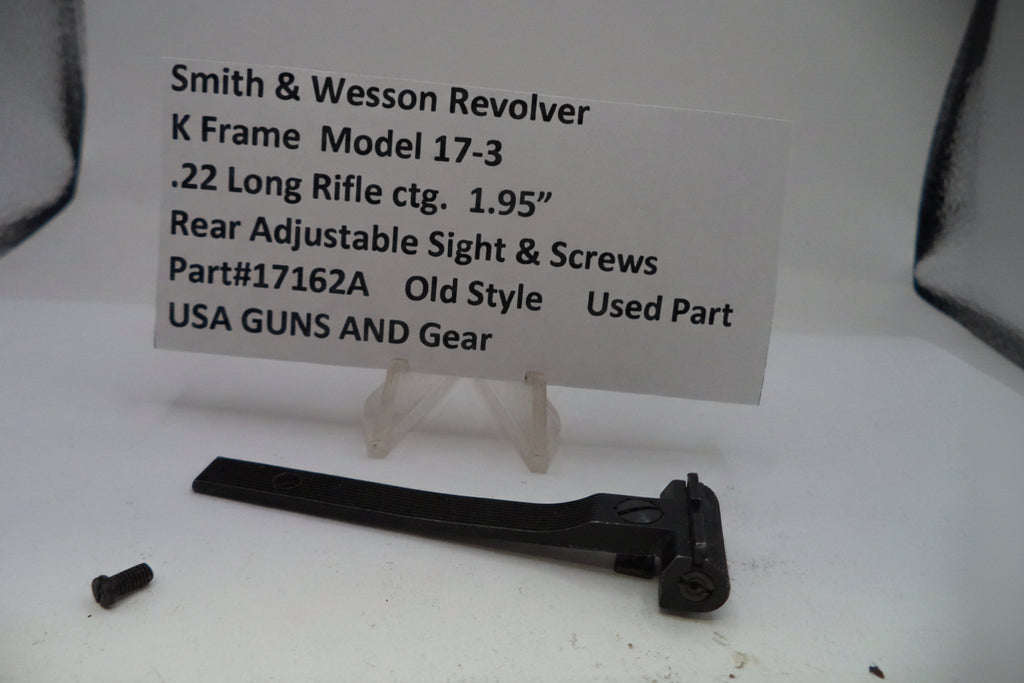 Smith & Wesson revolver part with descriptive card on a white background