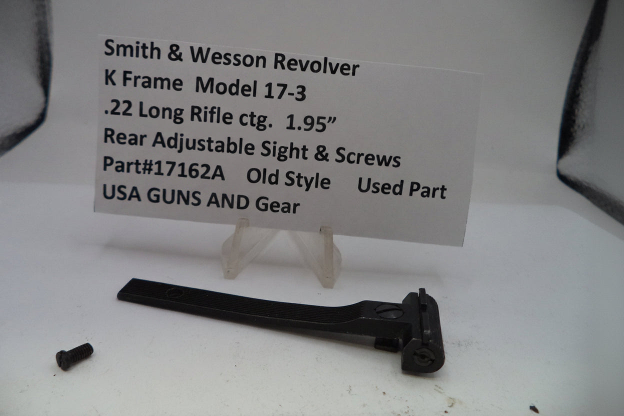 Smith & Wesson revolver part with descriptive card on a white background