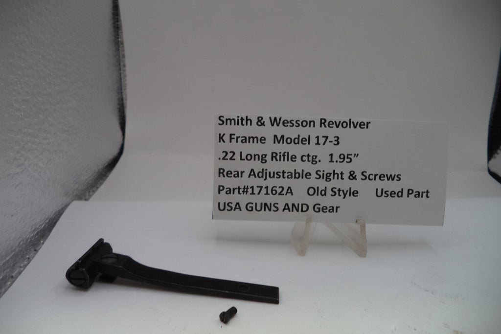 Smith & Wesson revolver part on a white surface with a label