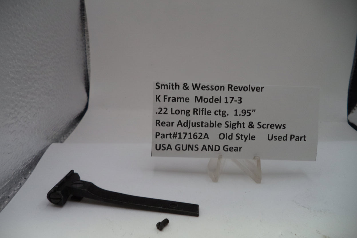 Smith & Wesson revolver part on a white surface with a label