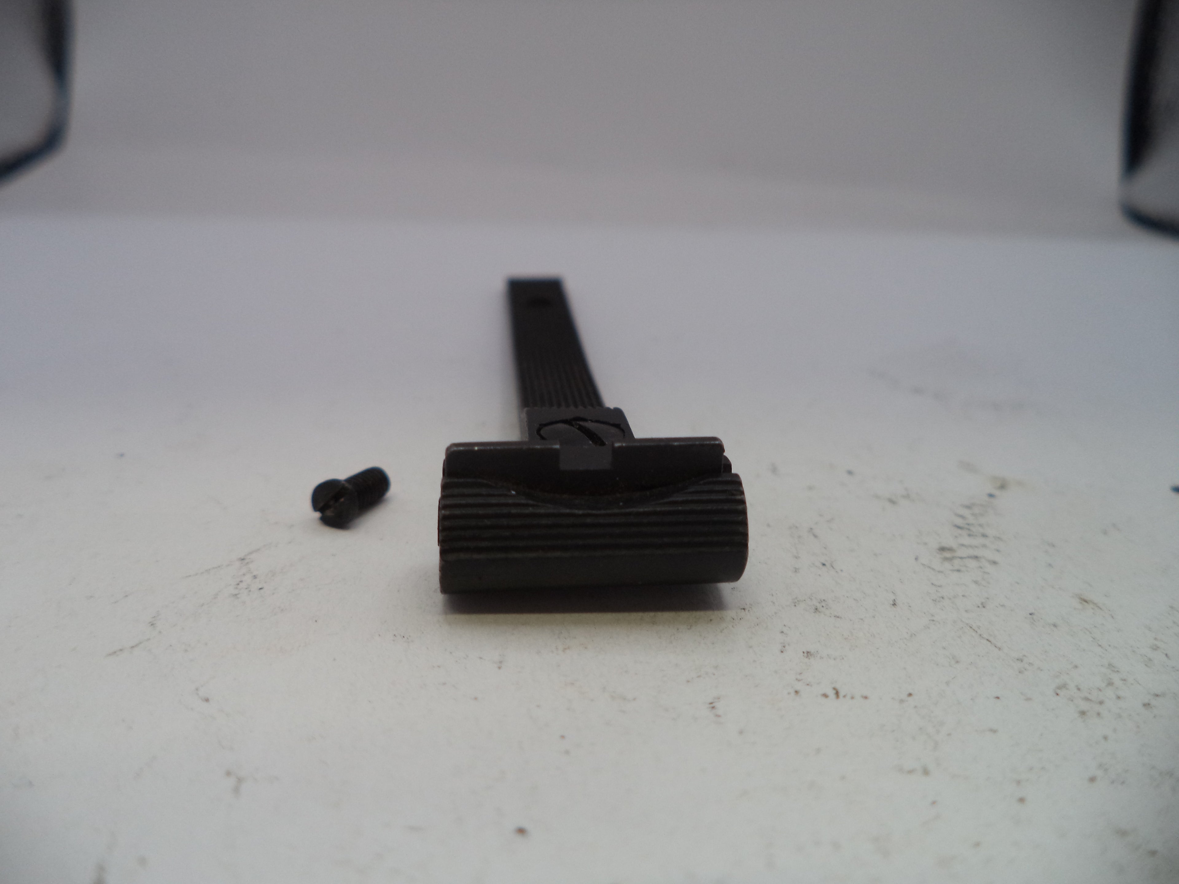 Black belt with a buckle on a white surface