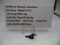 Smith & Wesson revolver part with descriptive card on a white background