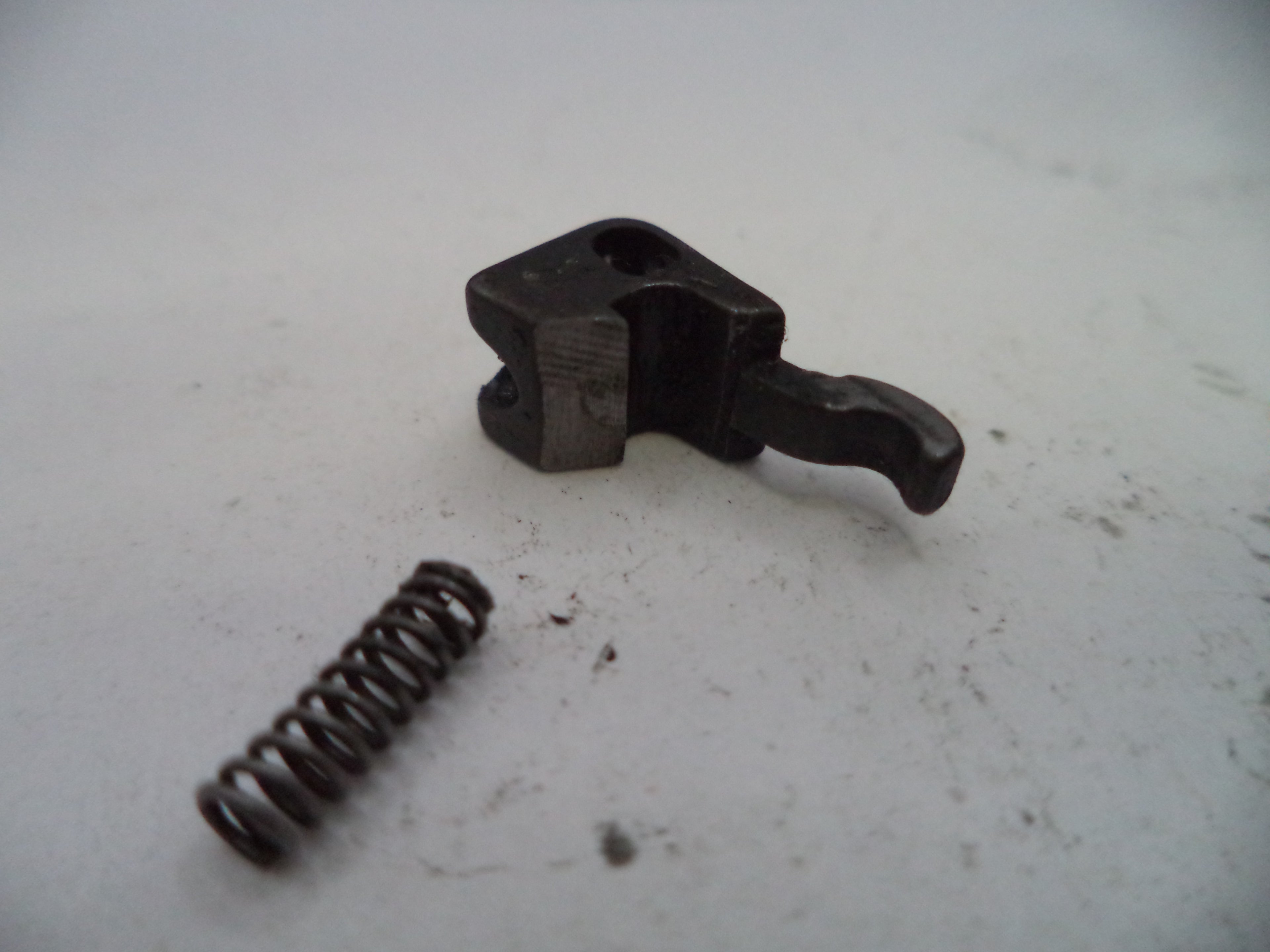 Mechanical component with a spring on a white background
