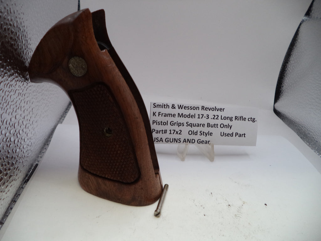 Brown pistol grip on a white surface with text about a Smith & Wesson revolver.