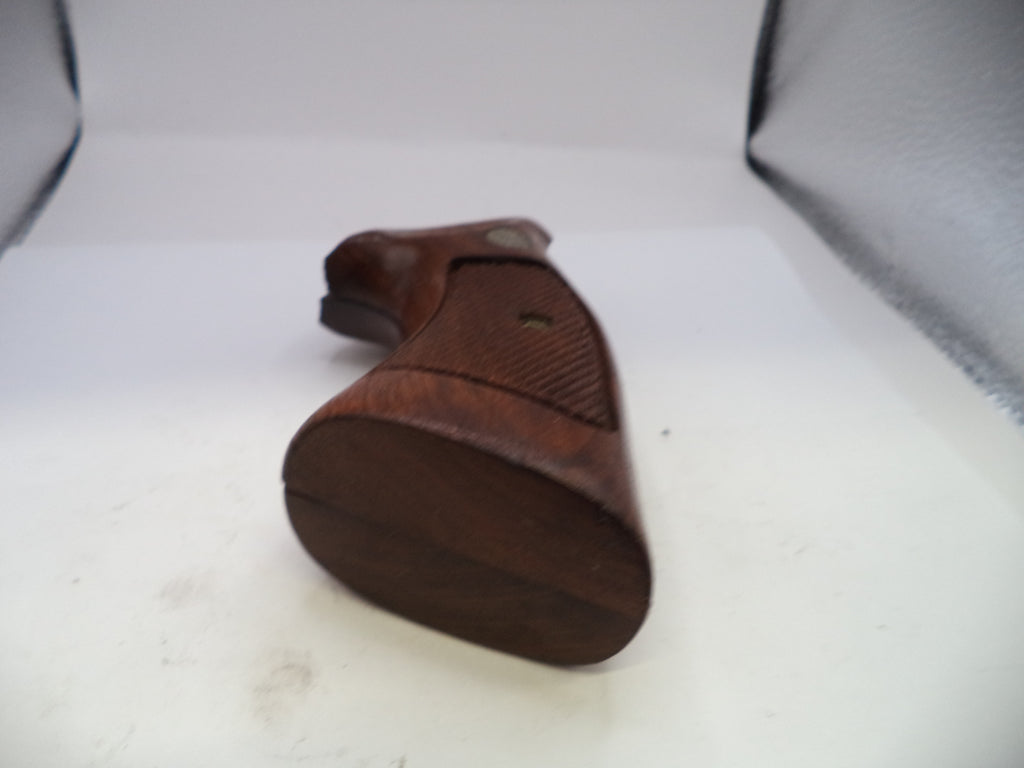 Wooden gun grip on a white background