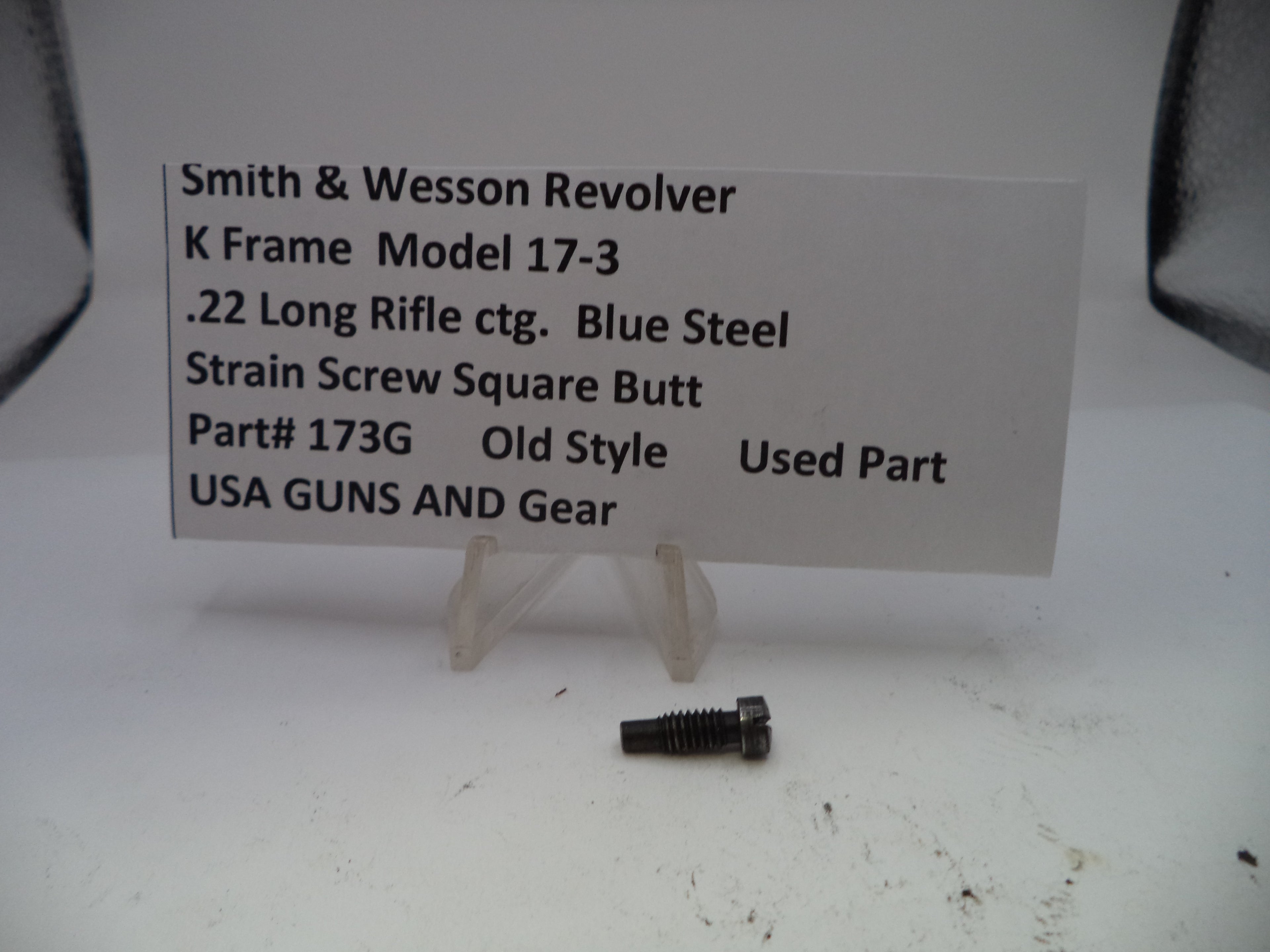 Smith & Wesson revolver part with descriptive label on a white background