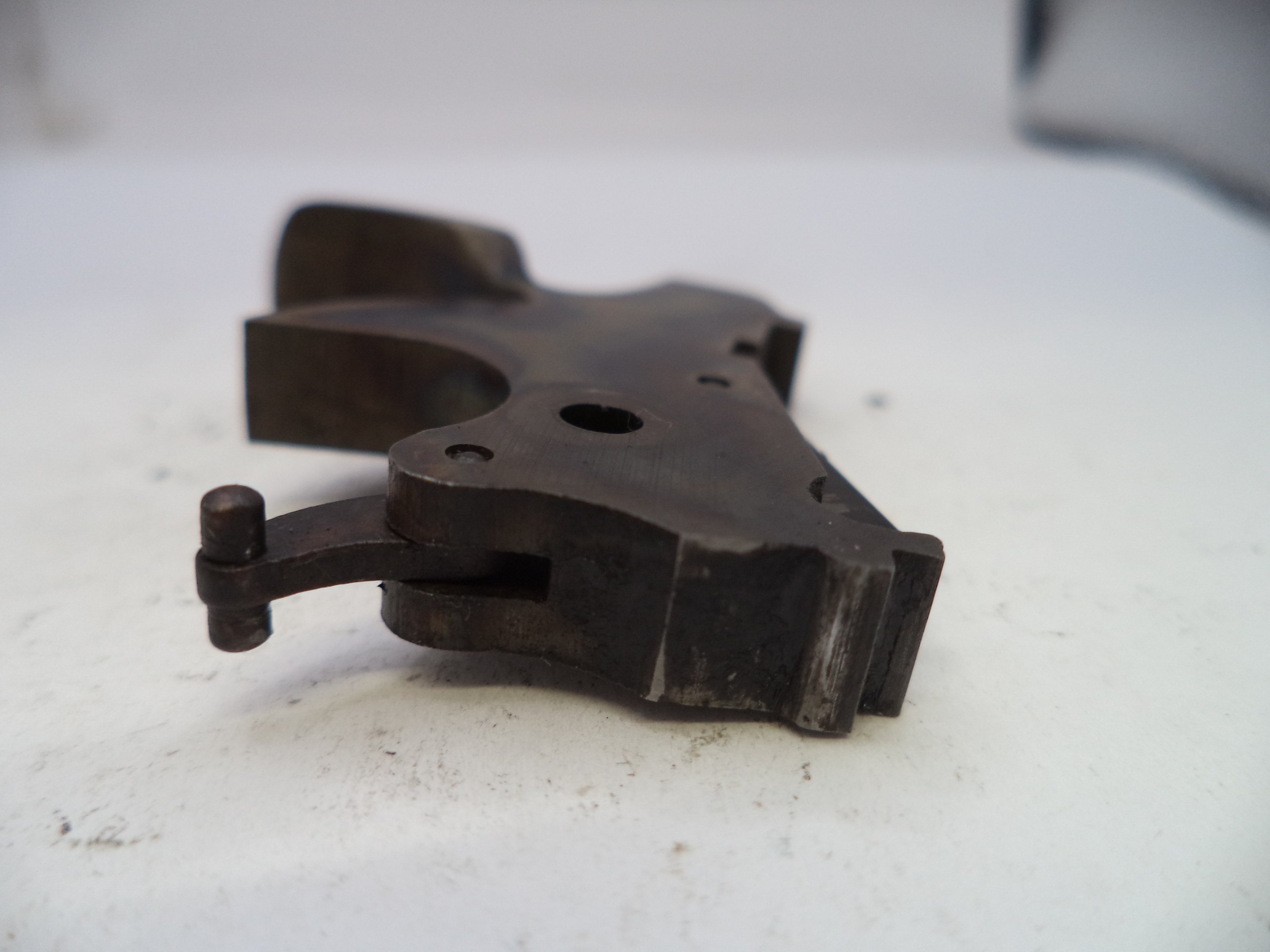 Metal mechanical component on a white surface