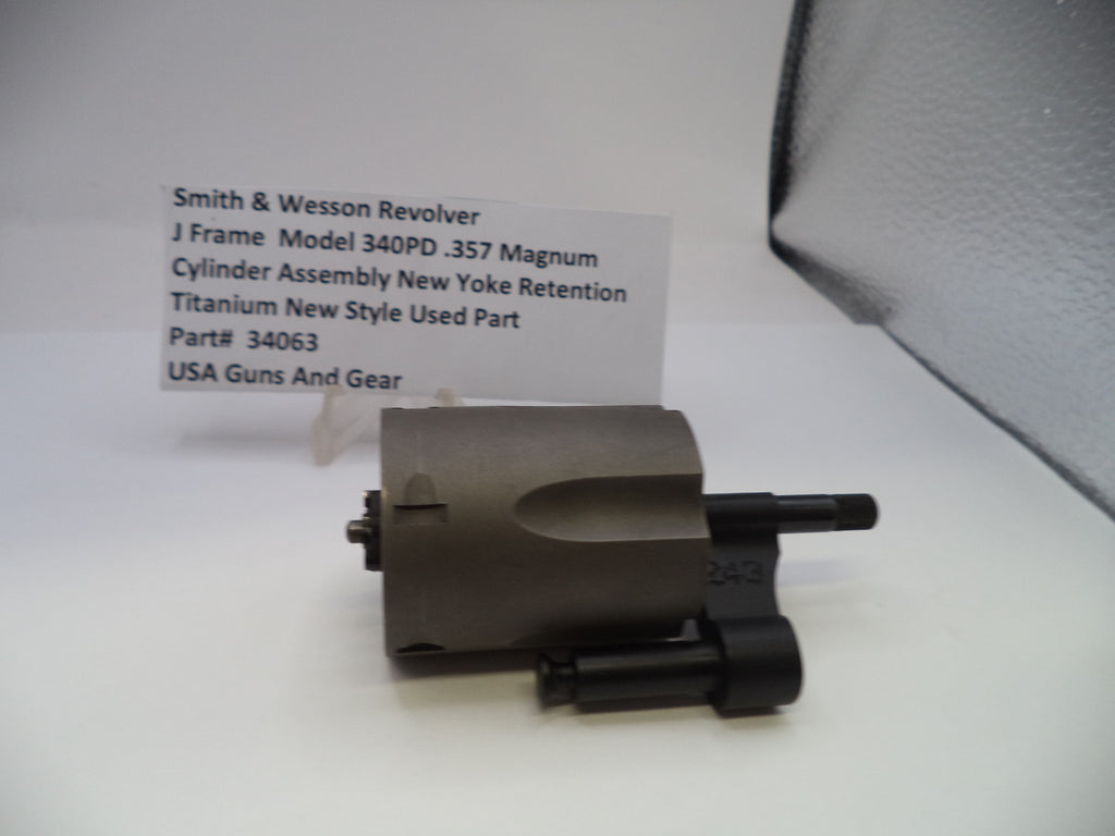Smith & Wesson revolver cylinder assembly on a white background with a label.