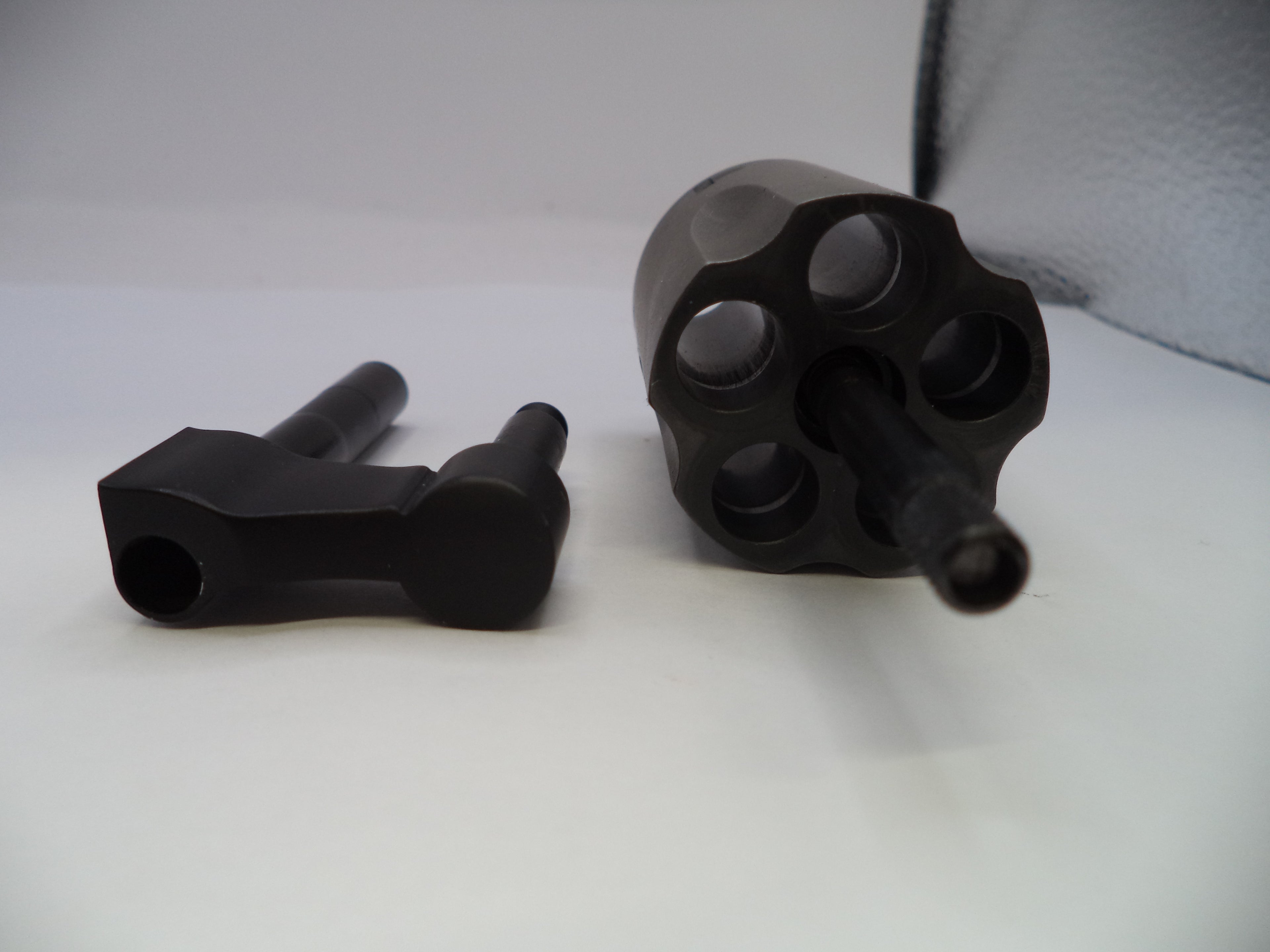 Black metal components on a white surface
