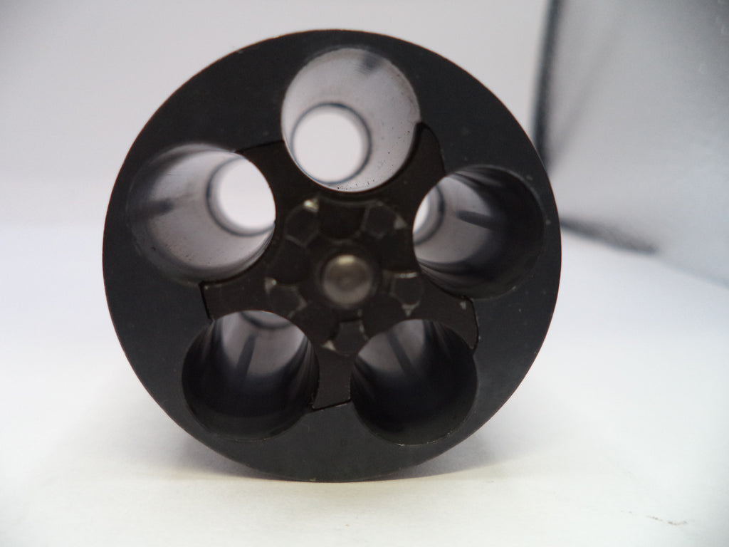 Black cylindrical object with multiple compartments on a white background