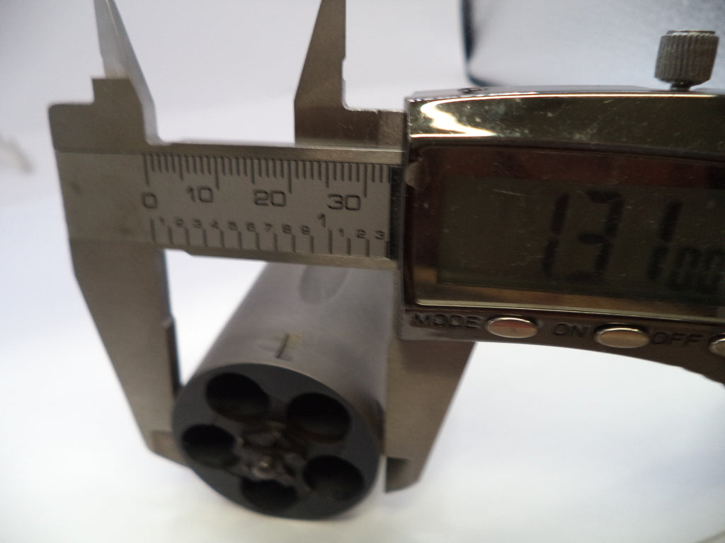 Digital caliper measuring a cylindrical object on a white background