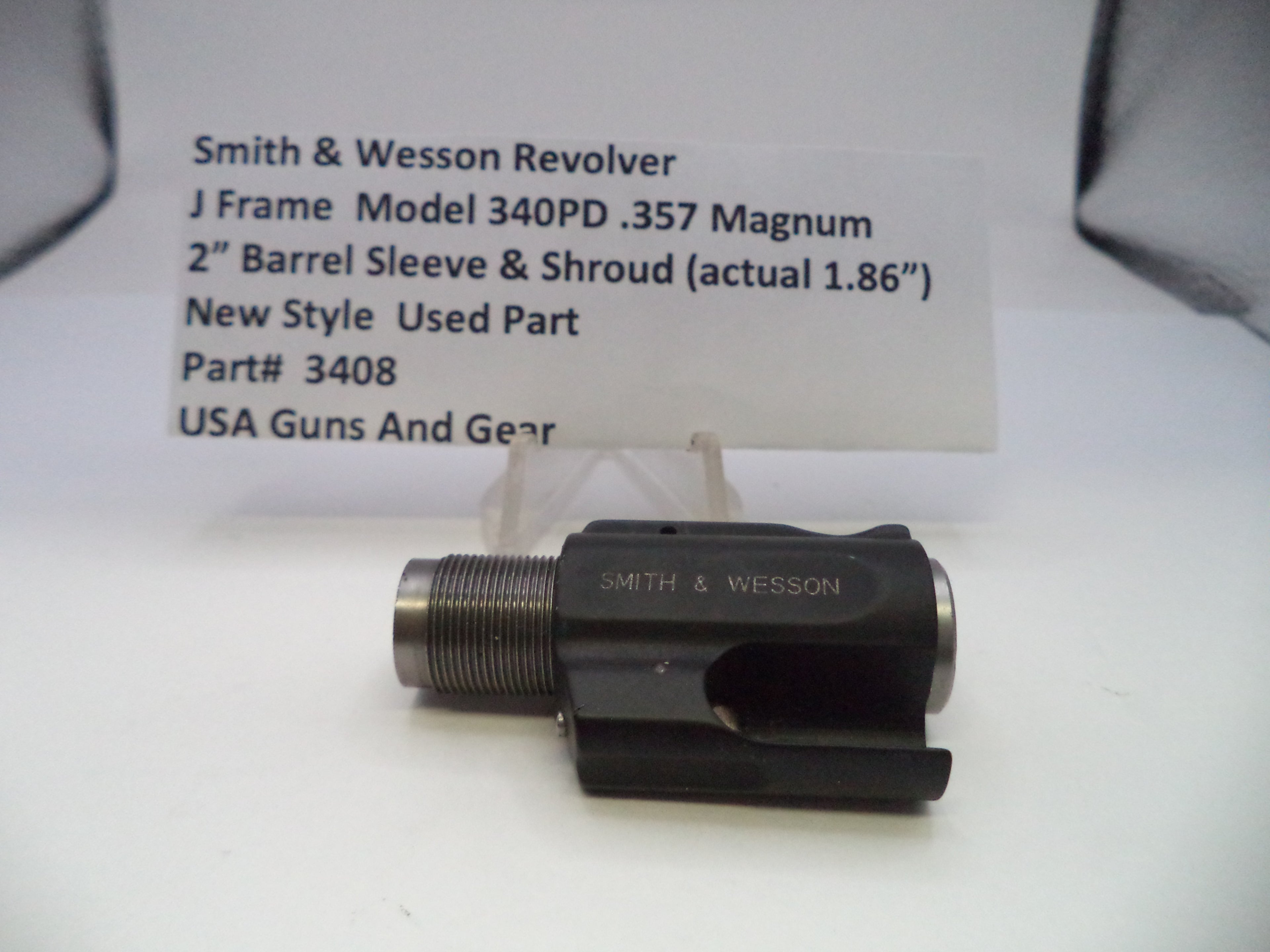 Smith & Wesson revolver part on a white background with a label