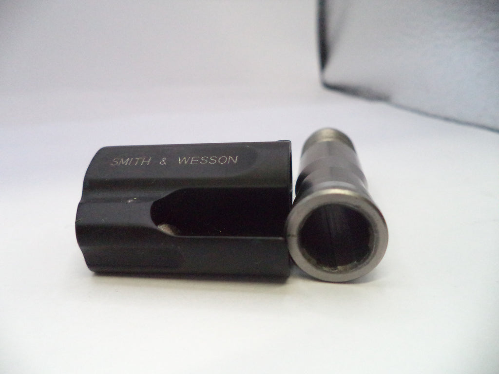 Black and silver cylindrical object with 'Smith & Wesson' branding on a white background