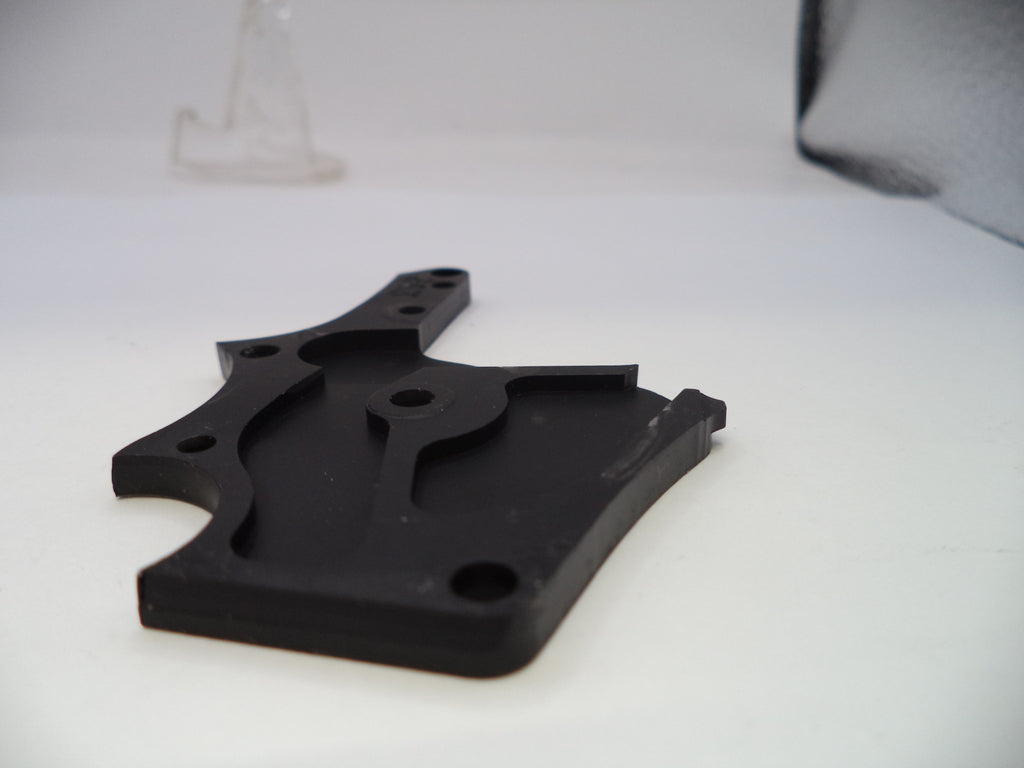 Black plastic bracket on a white background
