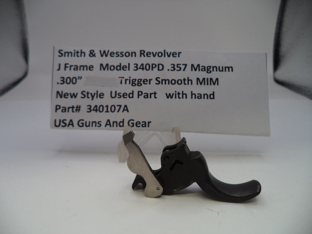 Trigger mechanism of a Smith & Wesson revolver with a label on a white background