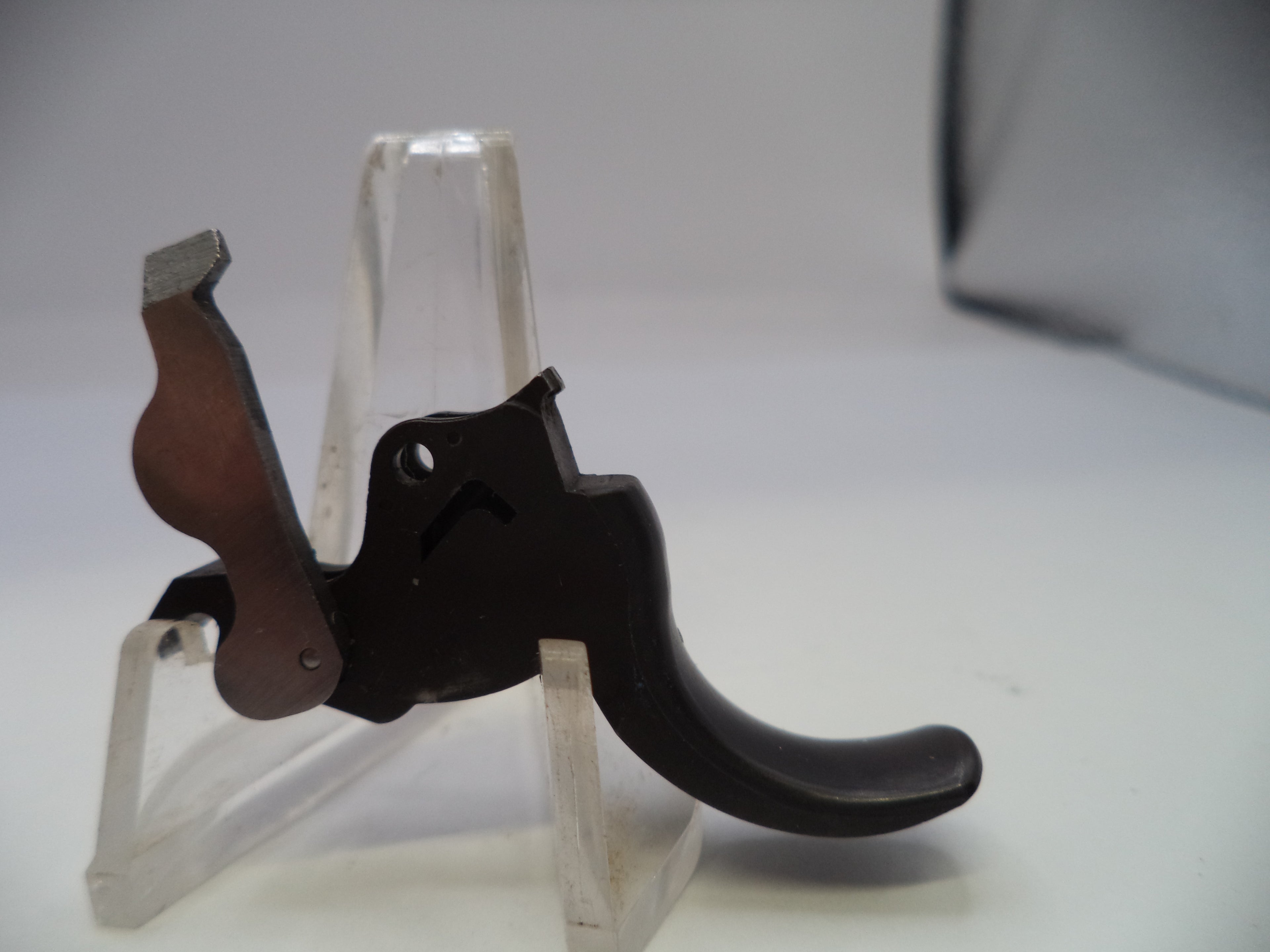 Guitar capo on a stand with a white background