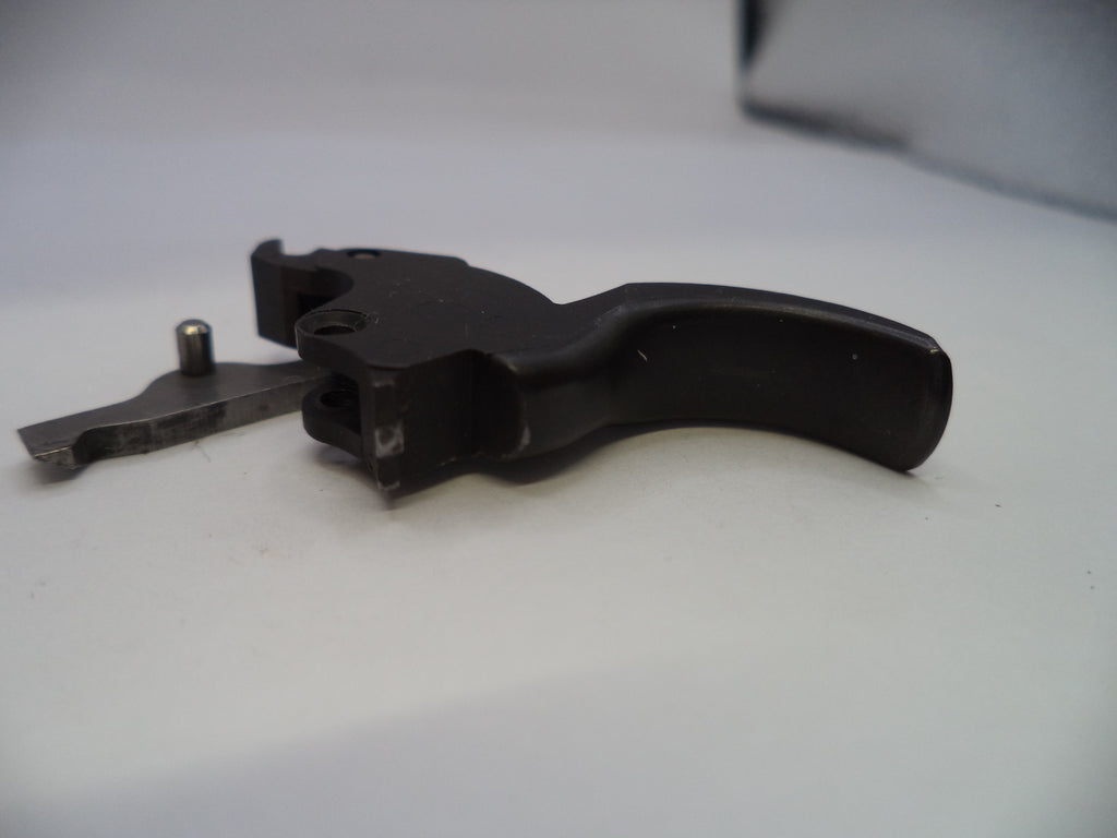 Black gun trigger on a white background