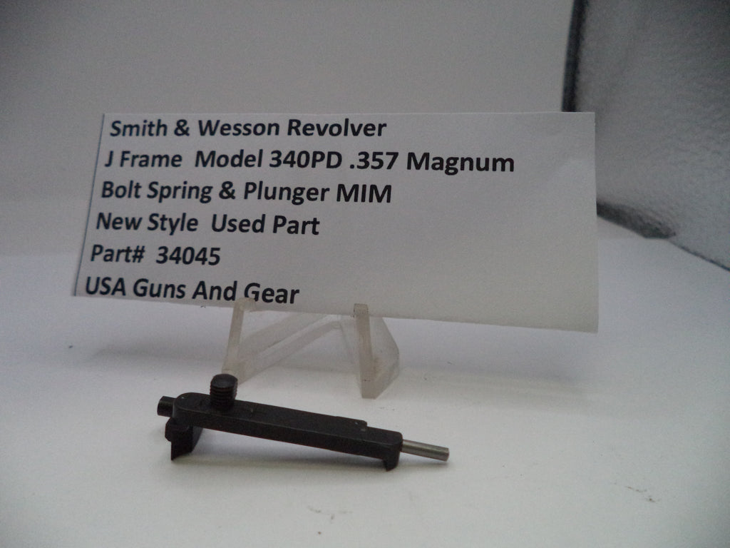 Smith & Wesson revolver part with descriptive card on a white background