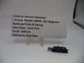 Smith & Wesson revolver slide and spring with a label on a white background