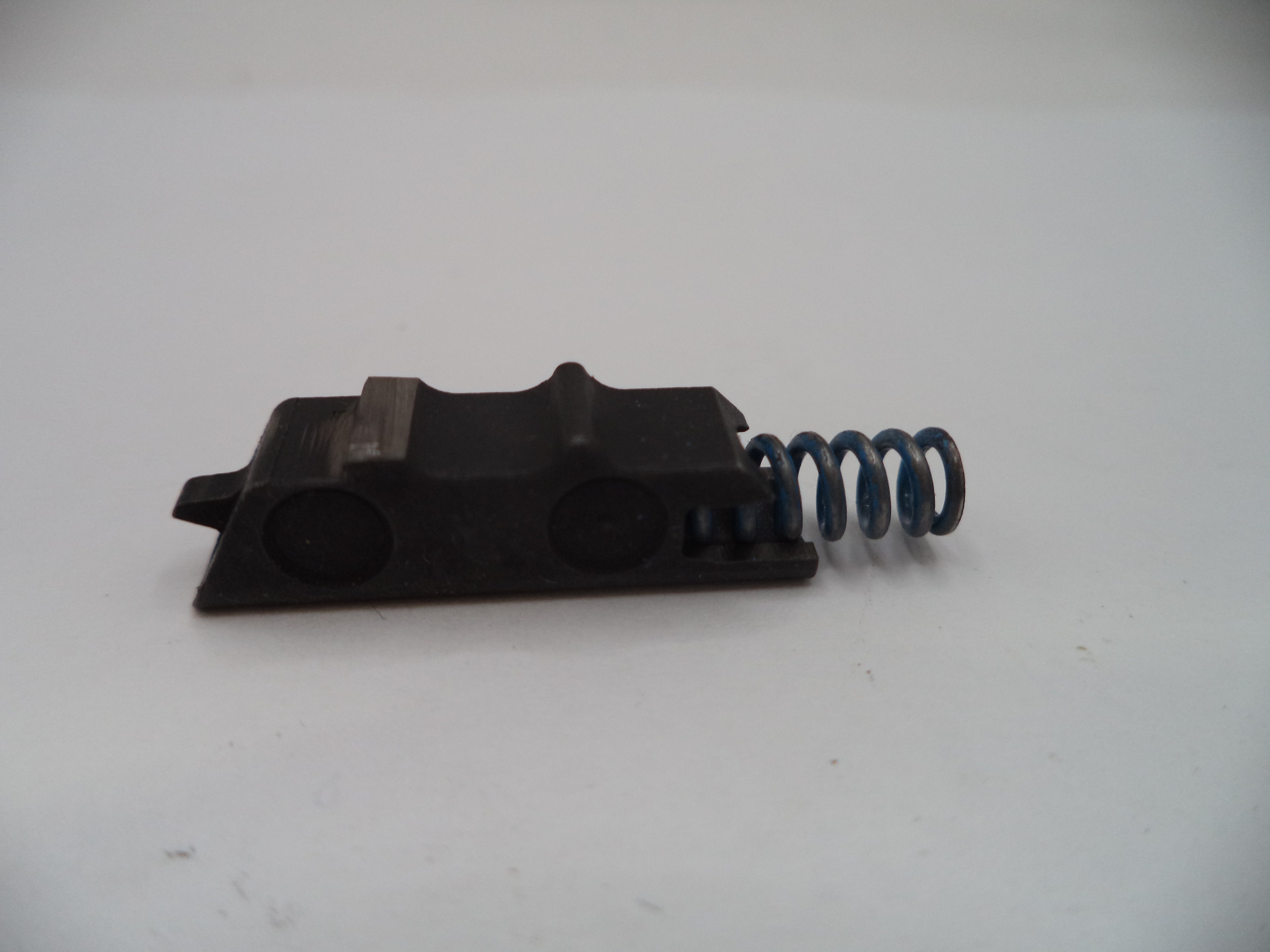 Mechanical component with a spring on a white background