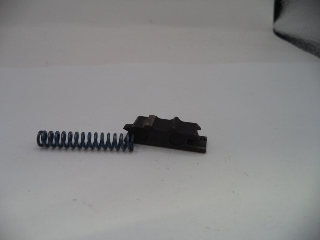 Black metal component with a spring on a white background