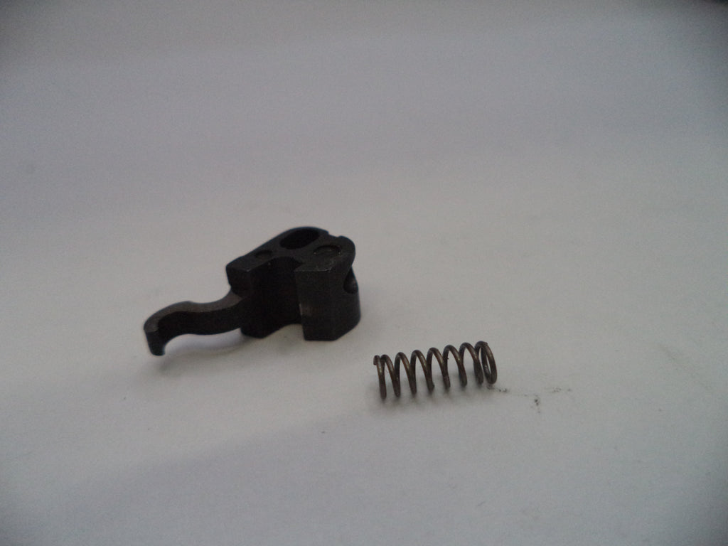 Black mechanical component and spring on a white background