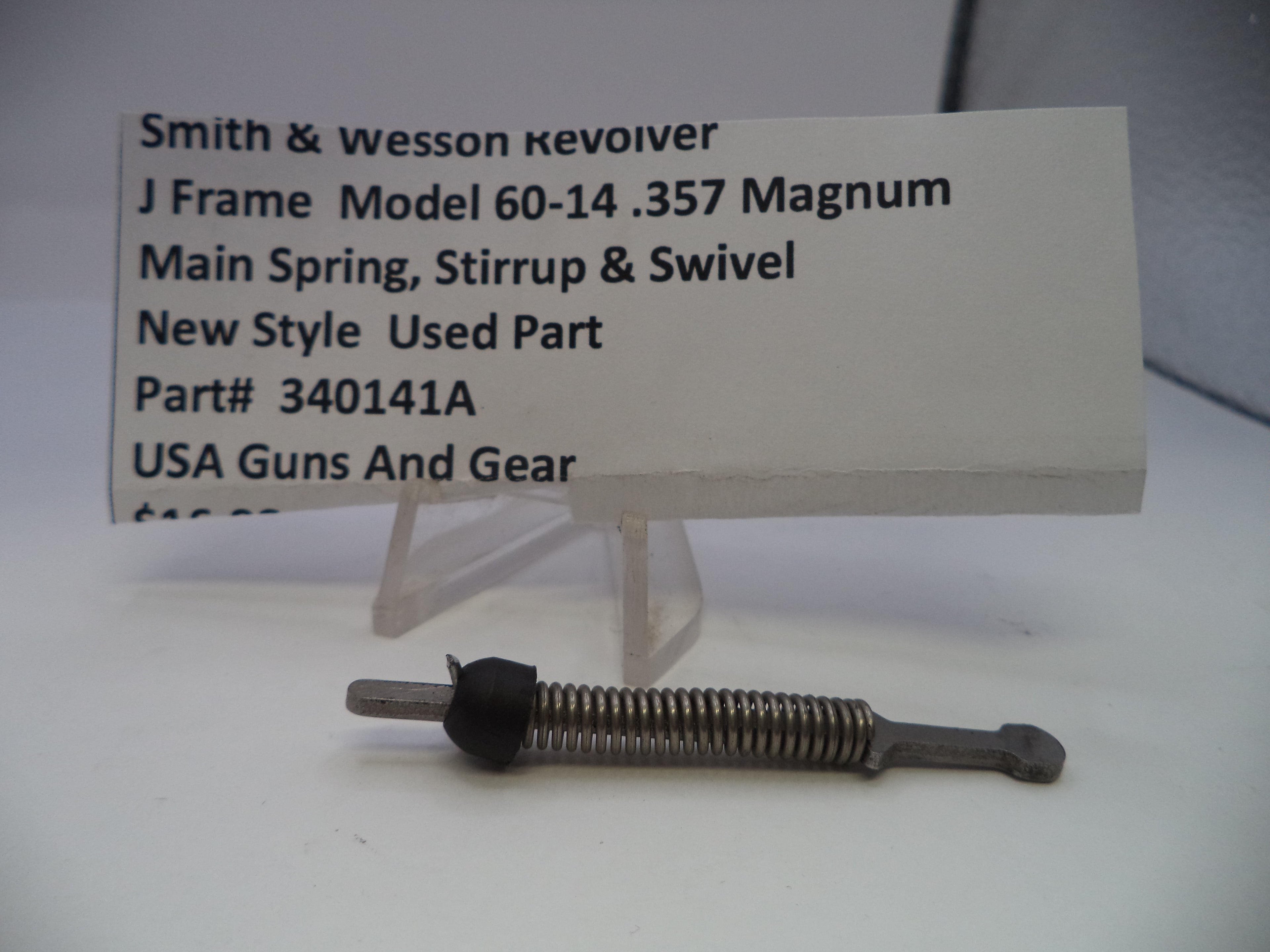 Smith & Wesson revolver main spring, stirrup, and swivel on a white background with a label.
