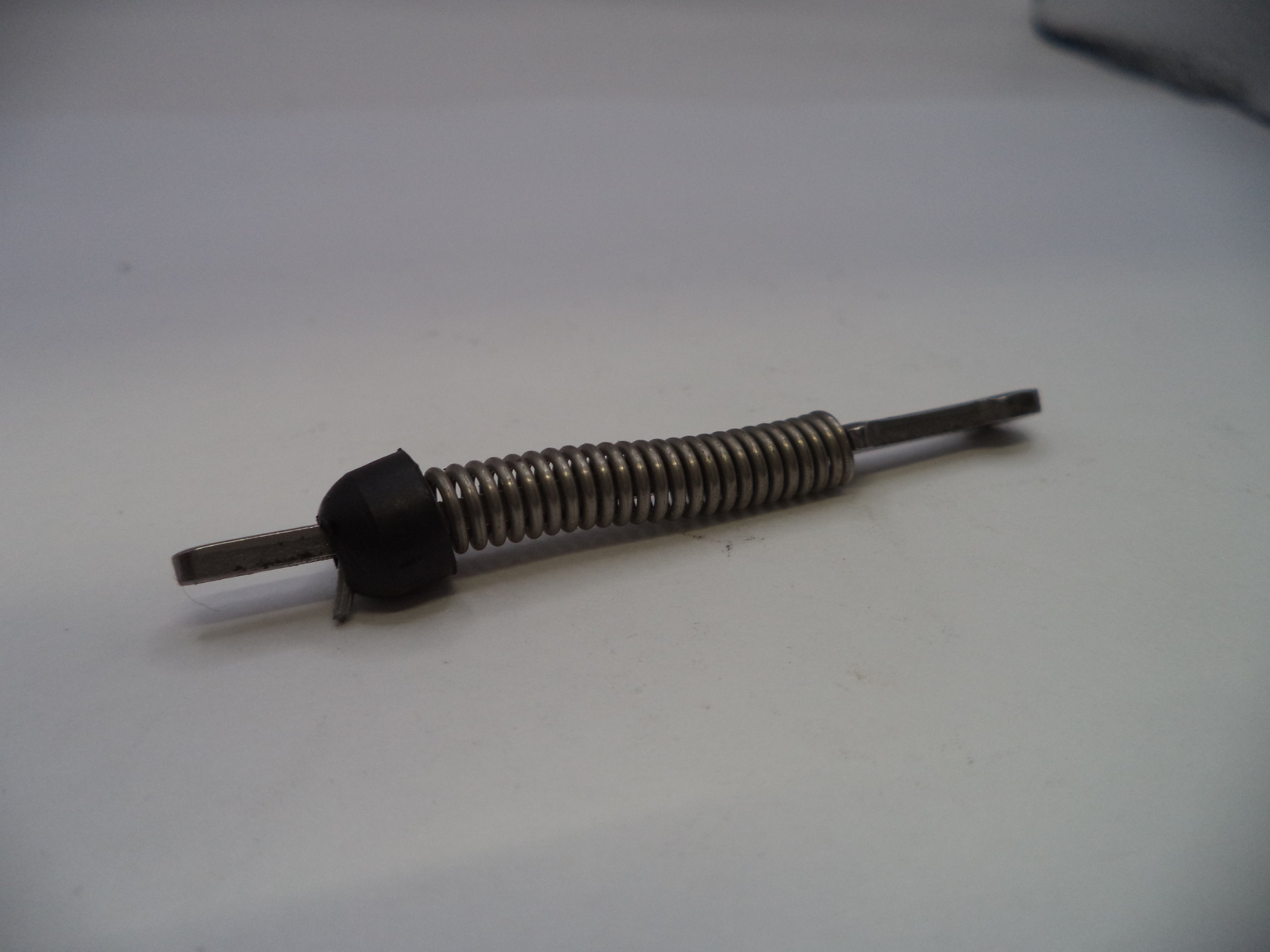 Mechanical component with spring on a white background