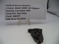 Black gun part with a label on a white background