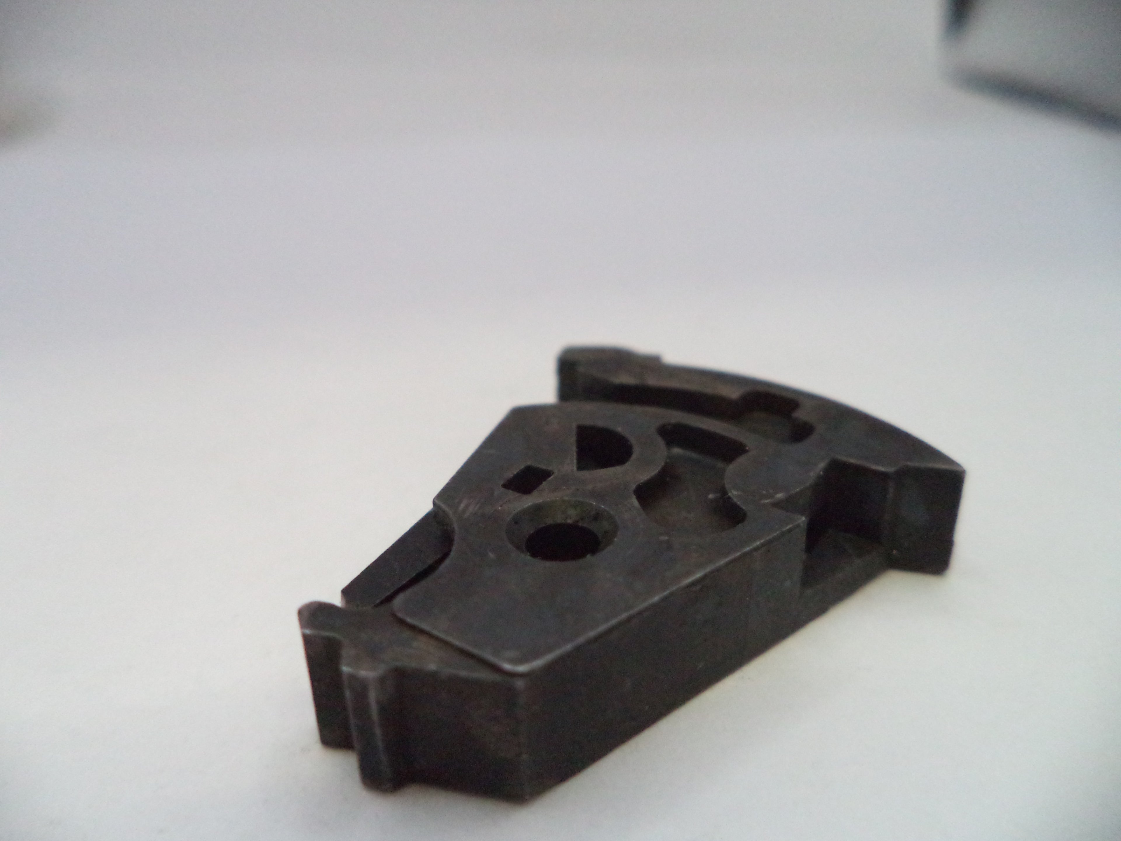 Black plastic component with 'B&J' branding on a white background