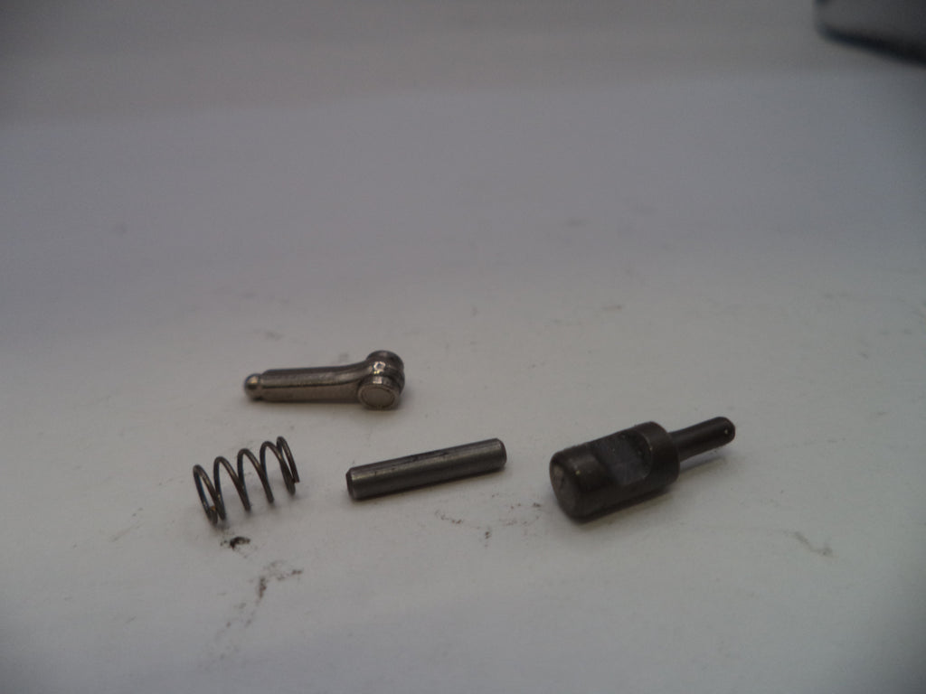 Four mechanical parts on a white surface