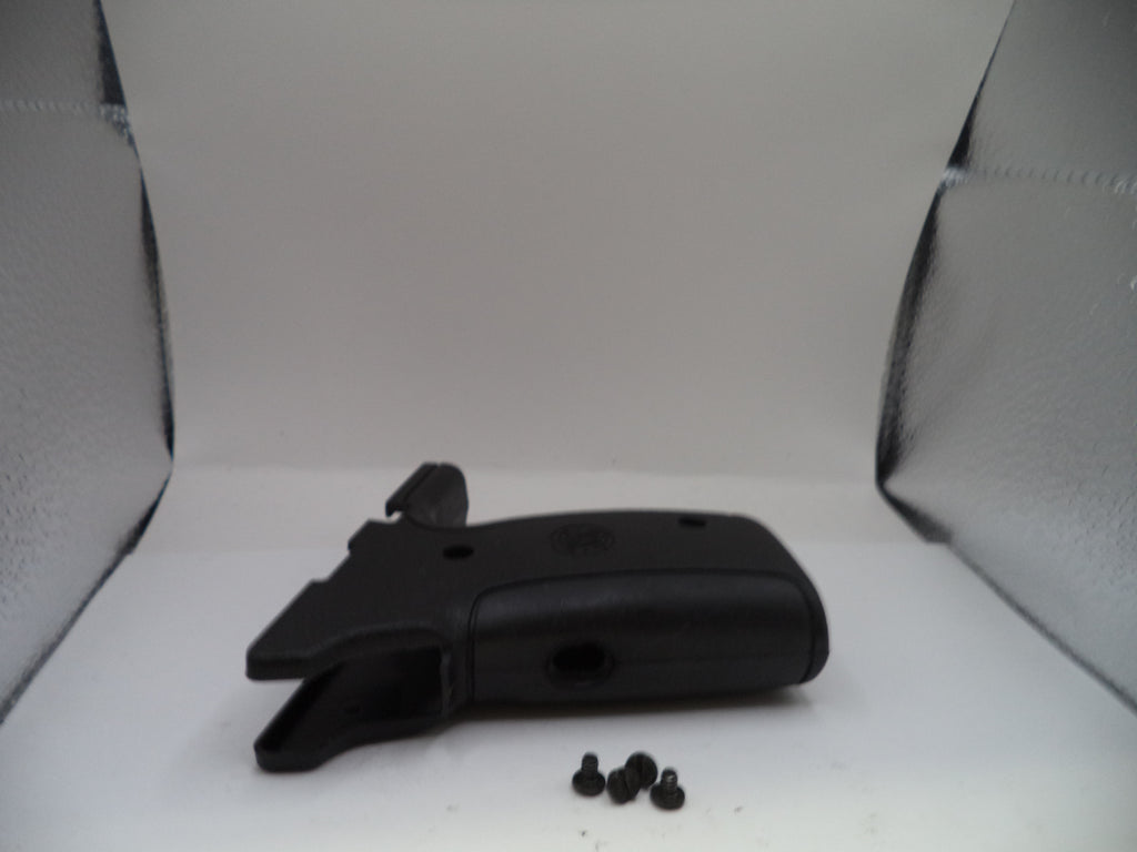 Black firearm part on a white background