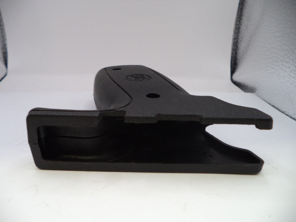 Black plastic component on a white background