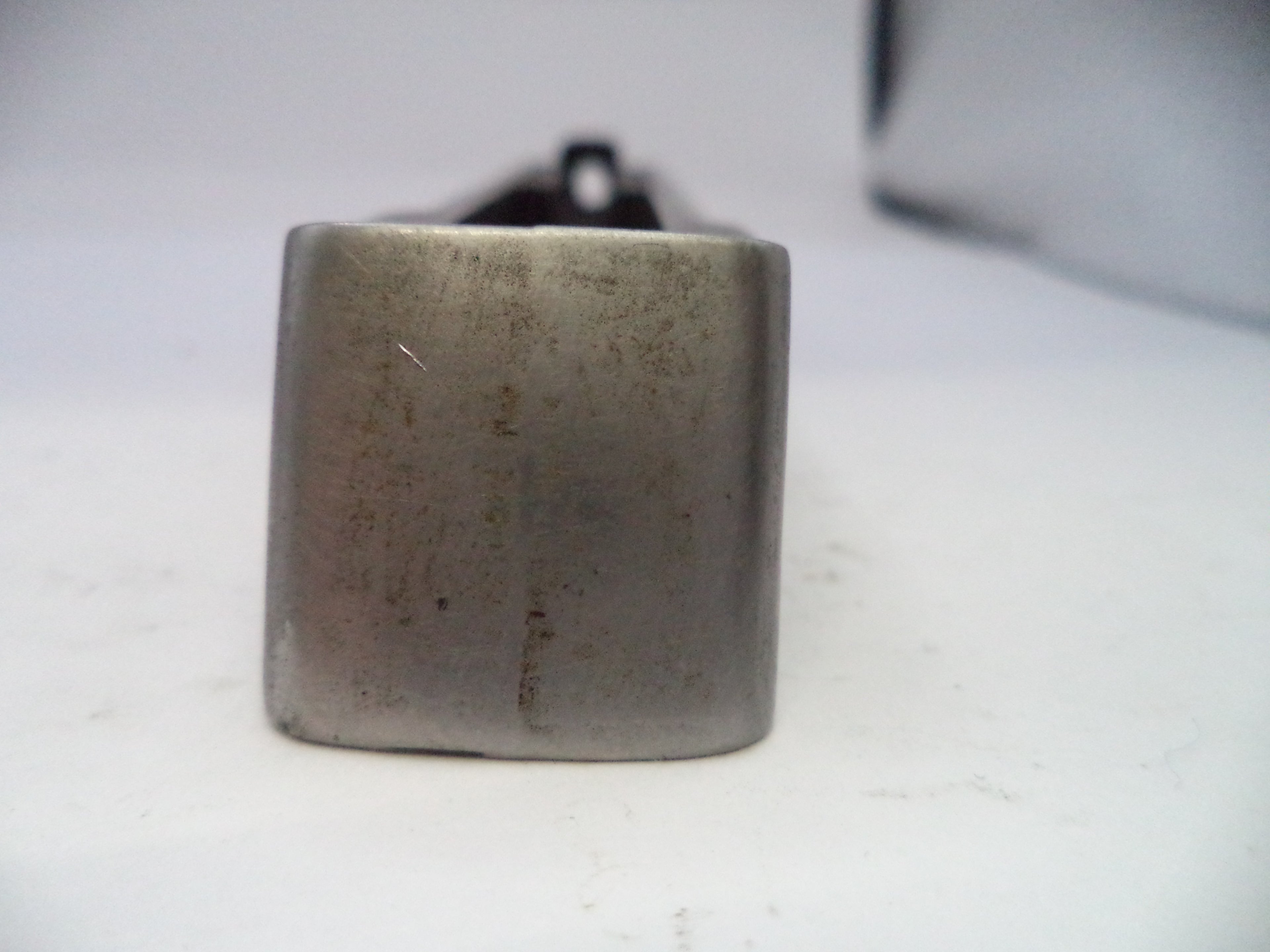 Metallic square object on a white background