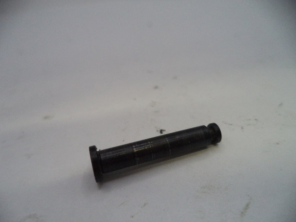 Black cylindrical object on a white surface