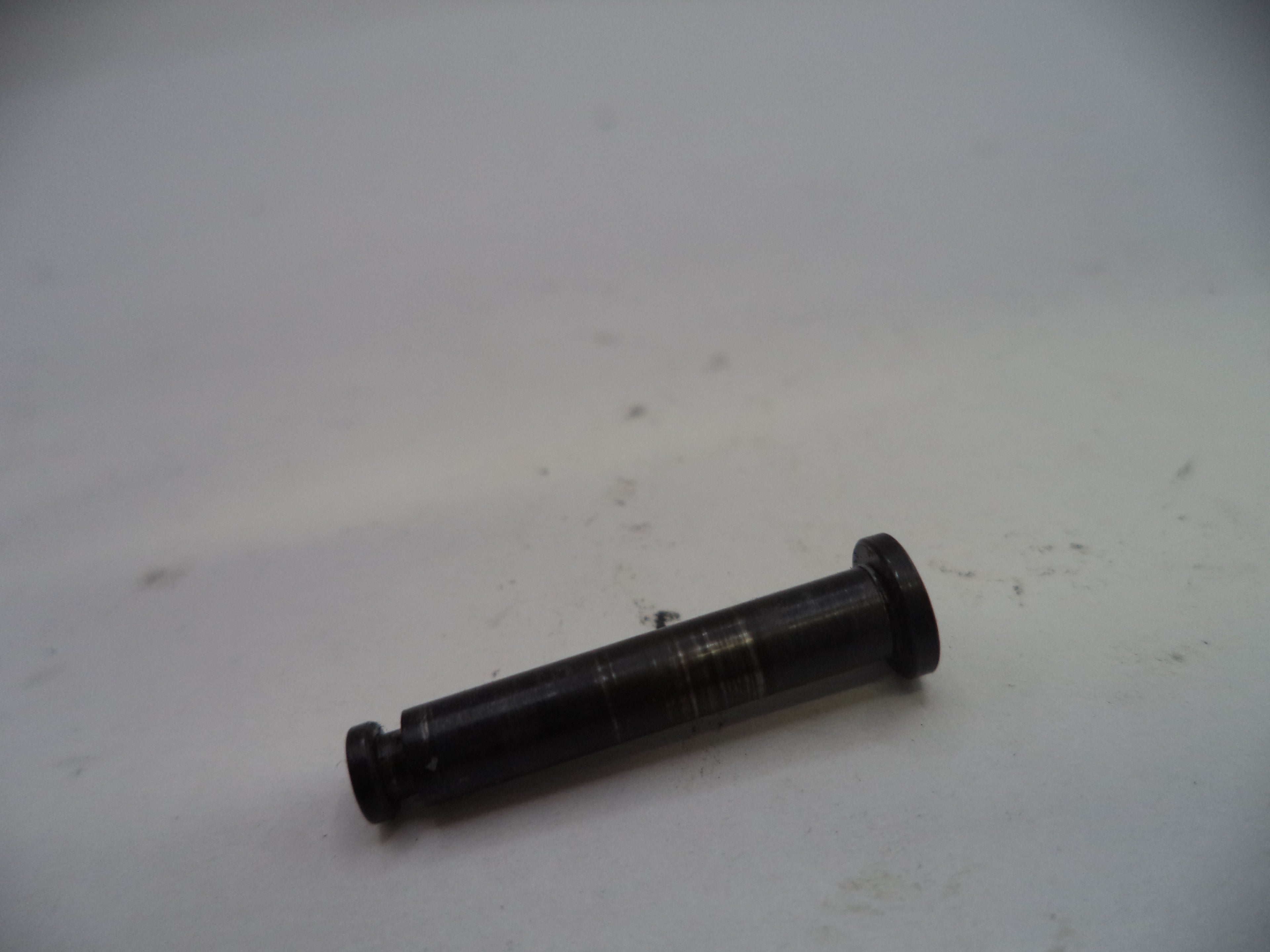 Black cylindrical object on a white surface