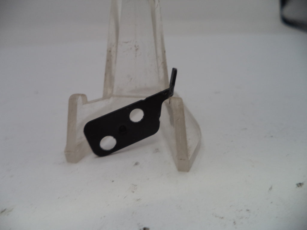 Metal bracket with a black component on a white background
