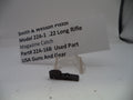 Smith & Wesson pistol magazine catch part with a label on a white background